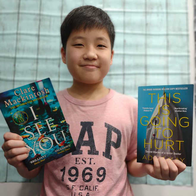 Writers Studio student holding two books