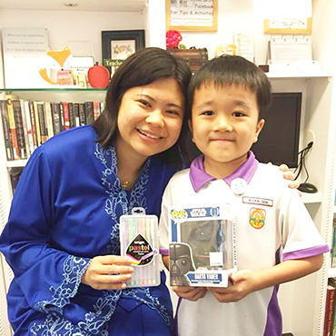 Teacher Diana with a student