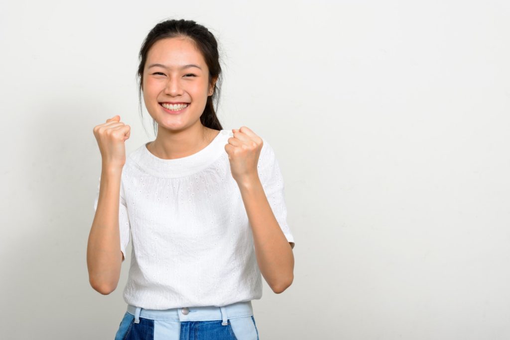 photo of a girl doing success gesture